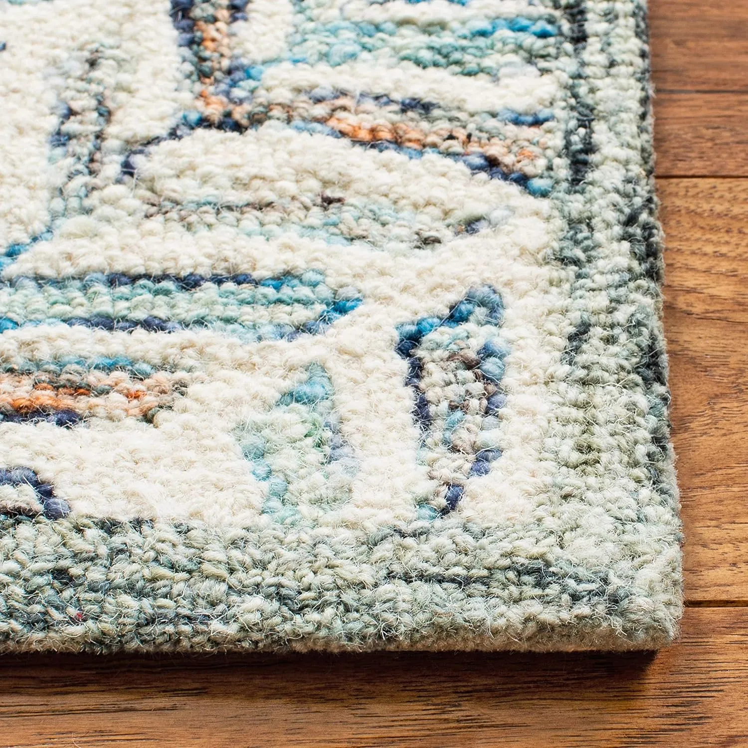 SAFAVIEH Capri Collection Area Rug - 9' x 12', Ivory & Blue, Handmade Wool, Ideal for High Traffic Areas in Living Room, Bedroom (CPR208A)