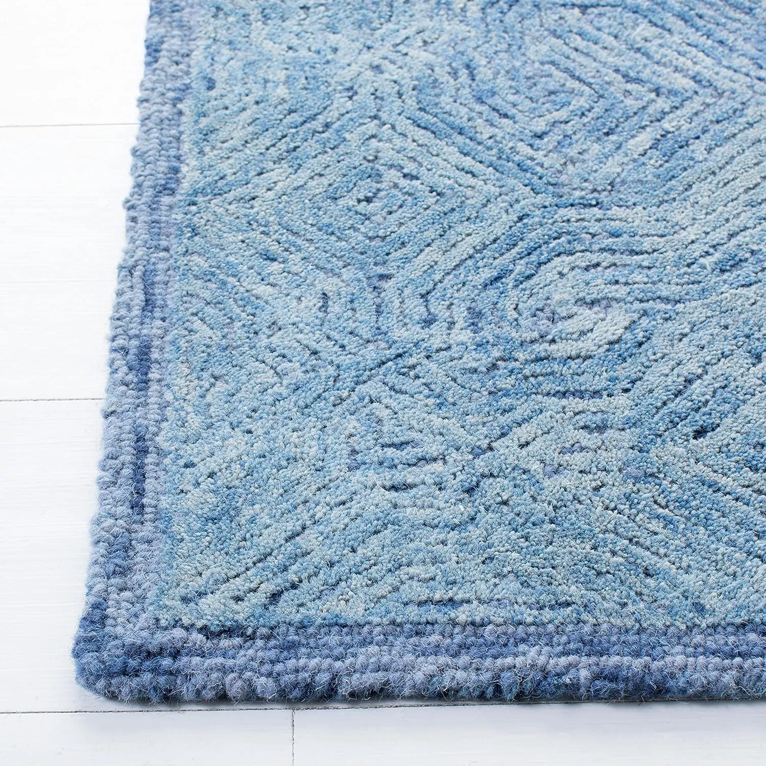 SAFAVIEH Ikat Collection Area Rug - 9' x 12', Blue, Handmade Wool, Ideal for High Traffic Areas in Living Room, Bedroom (IKT506M)