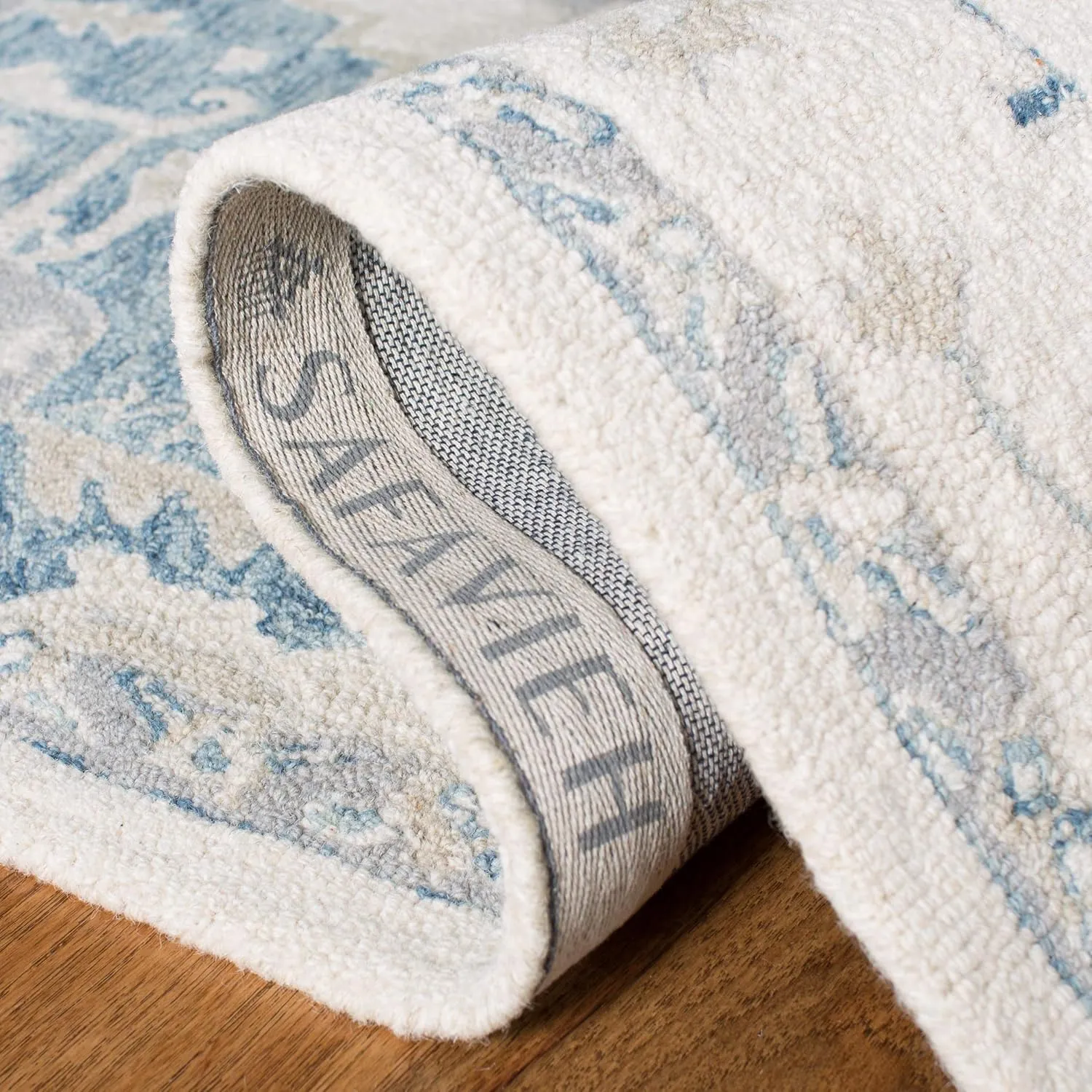 SAFAVIEH Micro-Loop Collection Runner Rug - 2'3" x 7', Ivory & Navy, Handmade Shabby Chic Medallion Wool, Ideal for High Traffic Areas in Living Room, Bedroom (MLP503L)